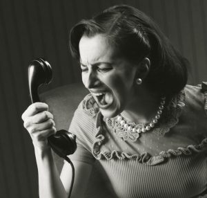 angry cold caller yelling at phone sales